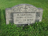  K Sandahl, Familjegrav, Dottern Mina 1892-1979. Gravsatta är Karl-Elof Johansson-Sandahl 1864-1949 och hustrun Sara Margareta (f Salomonsson) 1869-1942, samt dottern Anna Wilhelmina (Mina) 1892-1979.